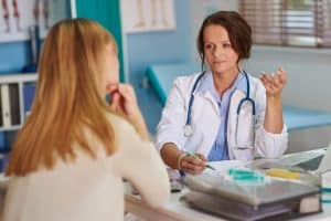 Doctor speaking with patient