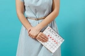 Woman Holding Period Calendar