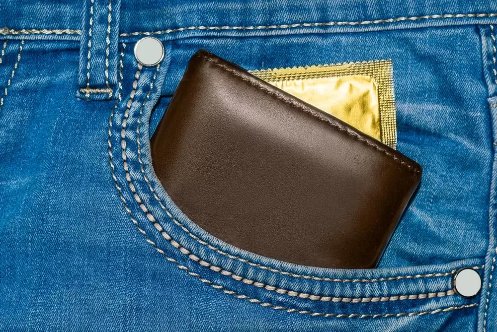 Condom tucked away in jean pocket