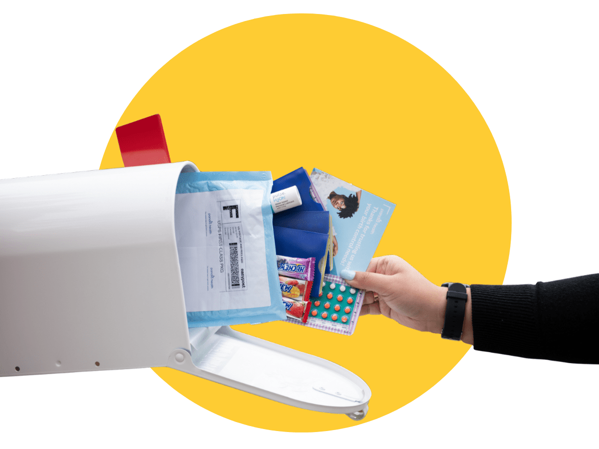 hand taking a Pandia Health package out of a white mailbox