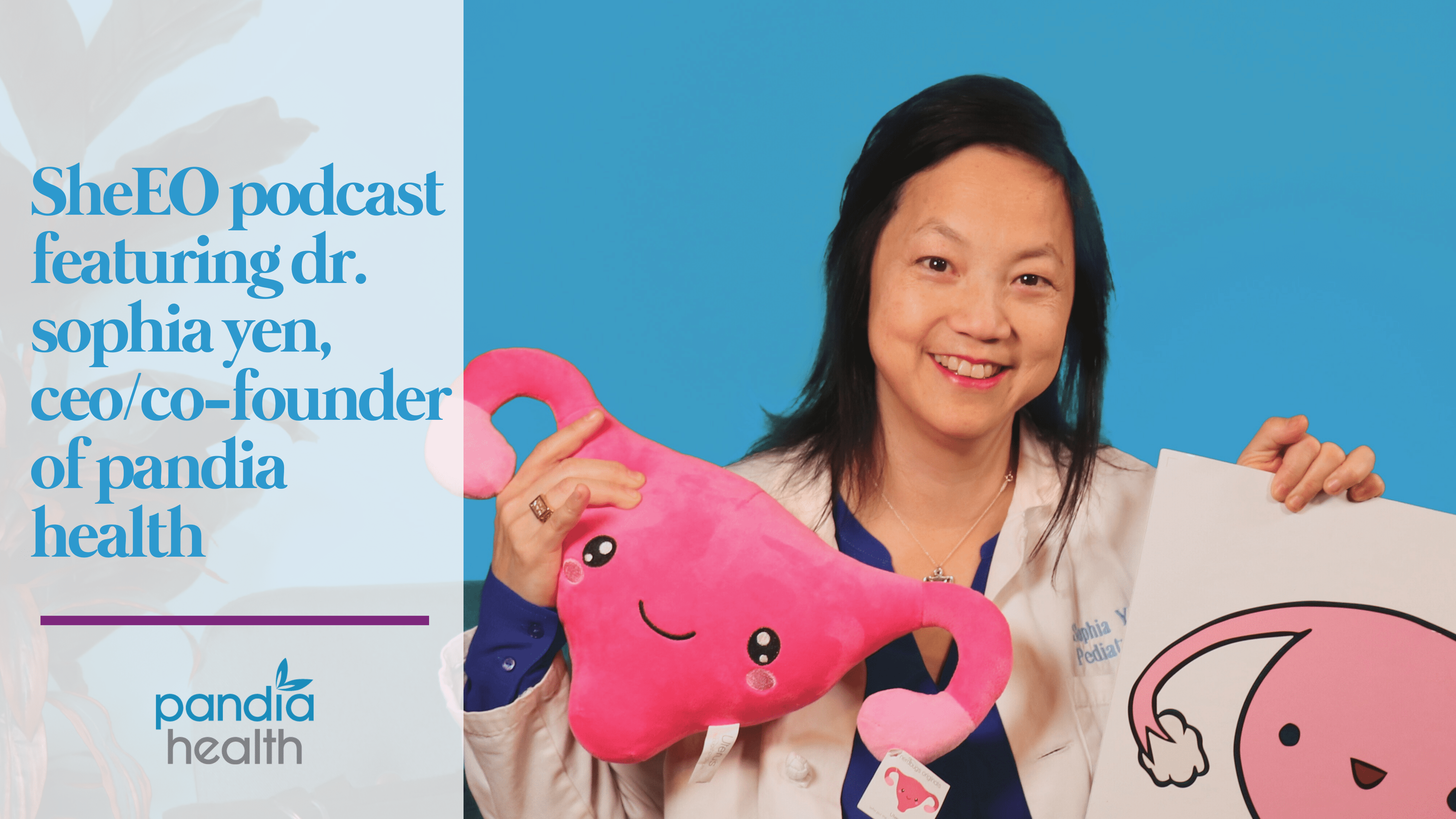 Dr. Sophia Yen smiling holding a pink uterus stuffed animal in one hand and a white shirt with a uterus on it in the other hand