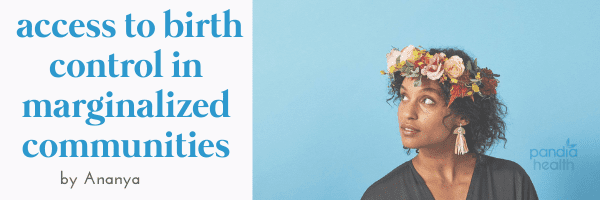 Black woman wearing flower crown looking up to left half-smiling