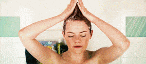 A woman washing her hair in the shower