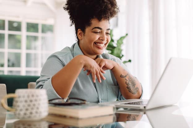 Happy young woman during an online birth control consultation