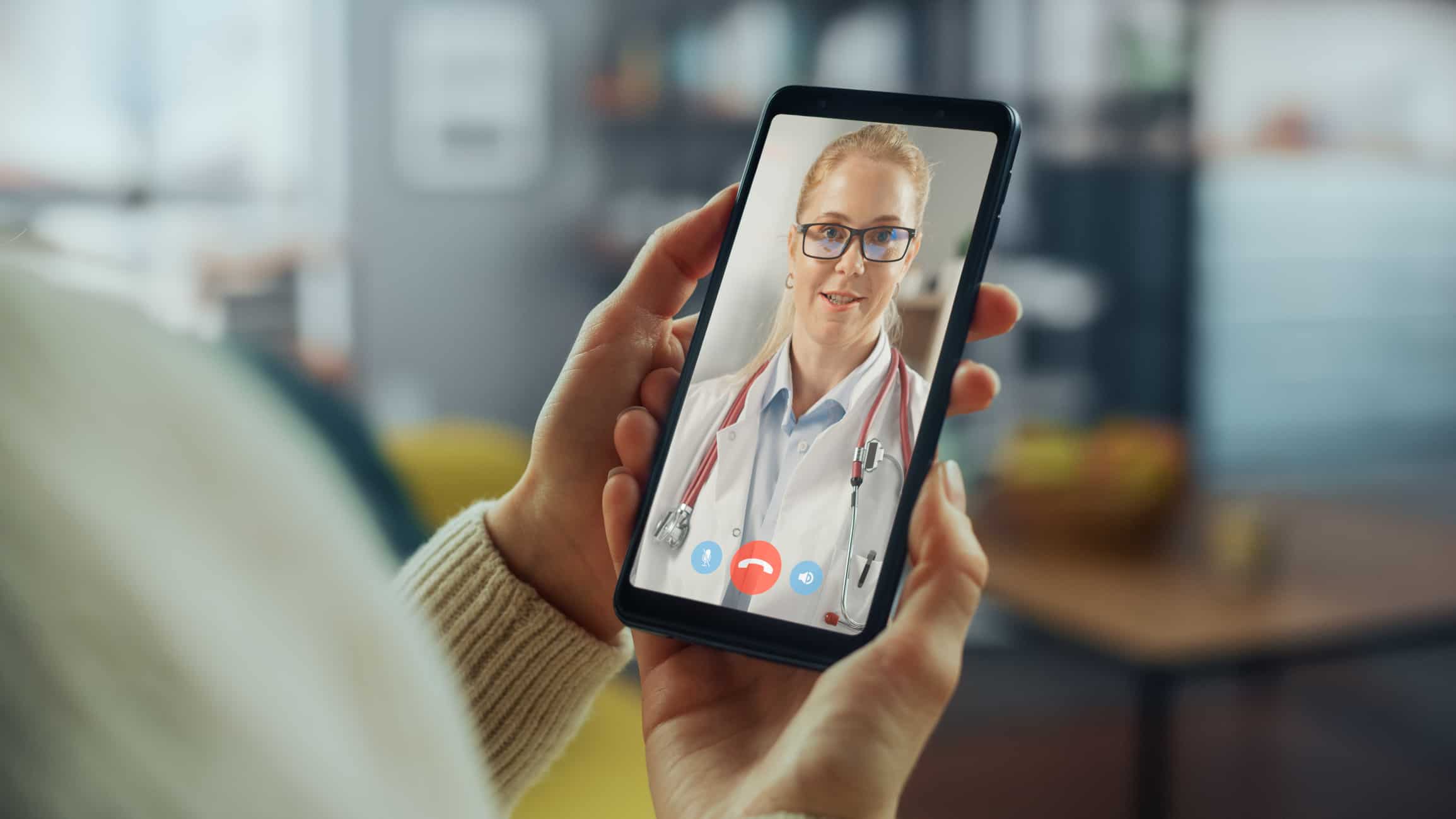 A young woman consults with her doctor during a telehealth birth control visit