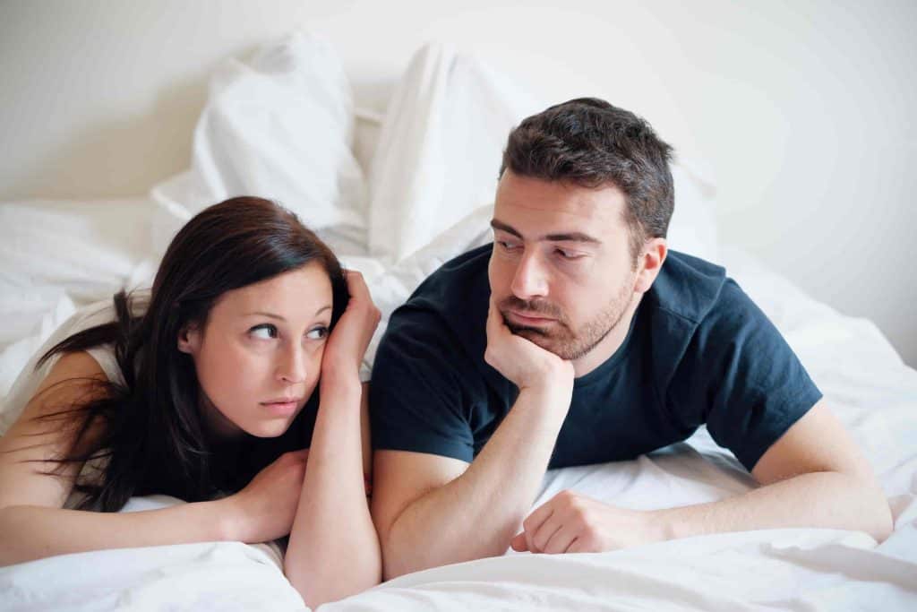 couple thinking in bed