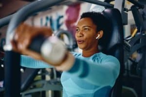 Woman at the gym working out using a machine