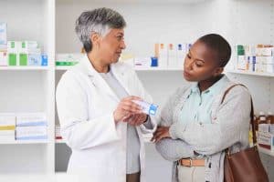 Pharmacist women advising customer for medicine info, healthcare services and product advice