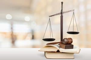 balance scale, wooden gavel and books