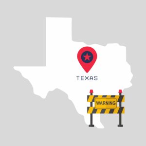 Texas map with warning sign barrier