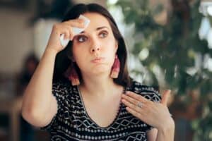 Woman Feeling Hot During Summer Wiping Her Forehead