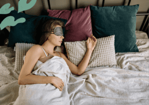 woman sleeping wearing a sleep mask.